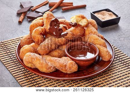 Twisted Korean Doughnuts - Kkwabaegi Sprinkled With Sugar And Served With Chocolate Sauce On A Clay 