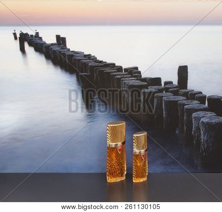 Diva, Fragrance For Ladies, Large Perfume Bottle Next To A Commercial Perfume Bottle In Front Of The