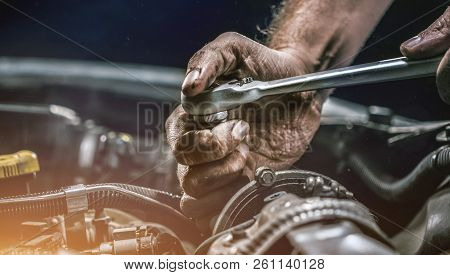 Auto Mechanic Working In Garage. Repair Service.