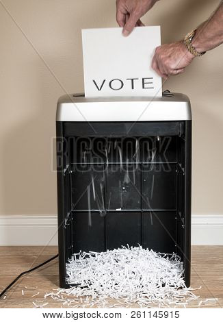 Simple Paper Vote Being Shredded As A Wasted Vote In An Office Shredder