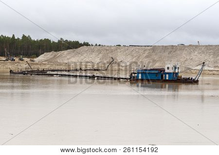 The Dredger Extracts Sand From The Quarry In The Forest. Interference In The Ecology Of The Forest.