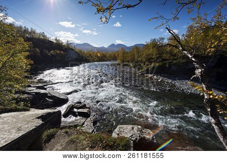 Landscape With A River And Mountains In Autumn. Abiskojokk (river) In The Abisko National Park, Swed