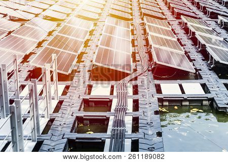 Floating Solar Farm Or Fpv Array Of Solar Panels On Water Lake River Pond