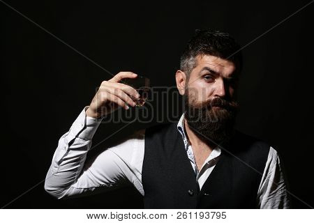 Rich Man With A Holding Glass Whiskey. Attractive Man With A Whiskey. Stylish Handsome Male In Suit 