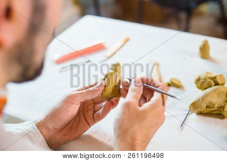 Potter Making Clay Figure For Board Game
