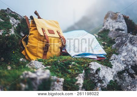 Hipster Hiker Tourist Yellow Backpack And Map Europe On Background Green Grass Nature In Mountain, B