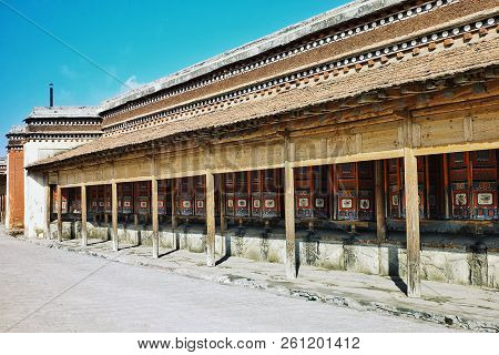Labrang Monastery, Xiahe, Gansu Province / China - Jun 6 2011: Prayer Wheels Waiting For The Pilgrim