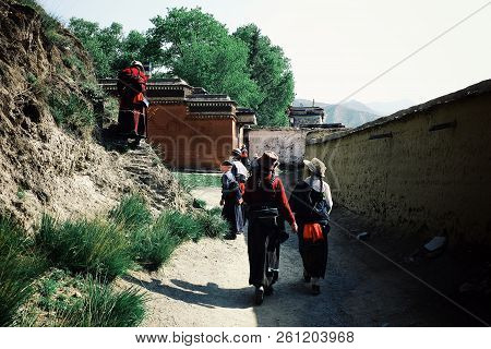Labrang Monastery, Xiahe, Gansu Province / China - Jun 6 2011: People Walking Around The Tibetan Bud