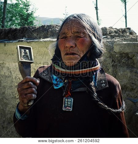 Labrang Monastery, Xiahe, Gansu Province / China - Jun 6 2011: Old Tibetan Buddhist Pilgrim Lady Wal
