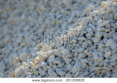Breakstone background. Road gravel. Gravel texture. Crushed Gravel background. Piles of limestone ro