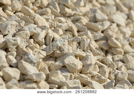 Breakstone background. Road gravel. Gravel texture. Crushed Gravel background. Piles of limestone ro