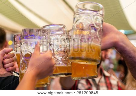 Koblenz Germany 26.09.2013 A Group Of Young People Friends Toasting With Glasses Of Bitburger Beer