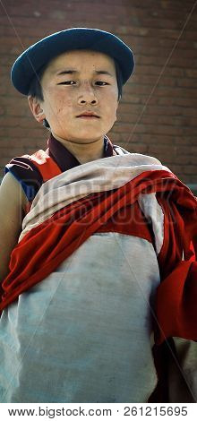Labrang Monastery, Xiahe, Gansu Province / China - Jun 6 2011: Young Tibetan Buddhist Novice Monk In