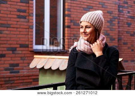 Portrait Female Student On Bright Background. Beautiful Modern Urban Young Woman Wearing Pink Knitti