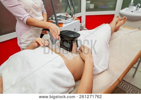Woman Getting Cryolipolysis Fat Treatment Procedure In Professional Cosmetic Cabinet Or Spa Center