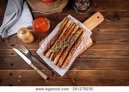 Pork Chipolata. Close-up View Of Fried Sausages. Meat Dish