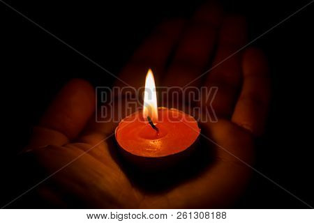 Burning Candle On The Palm, Close Up