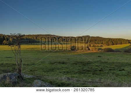 Sunset Meadows With Stones Near Zbytiny Village In National Park Sumava