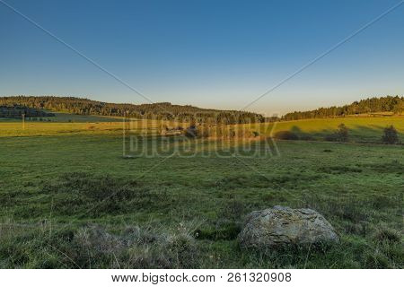 Sunset Meadows With Stones Near Zbytiny Village In National Park Sumava
