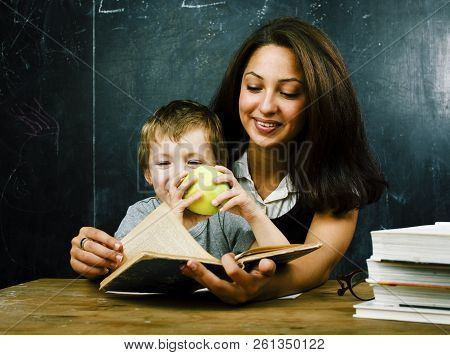 Little Cute Boy Pupil With Young Real Teacher, Classroom Studyin