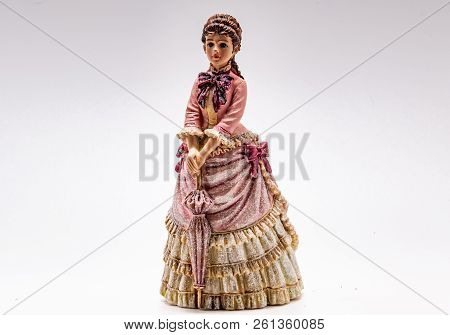 Porcelain Figurines-girls On A White Background Closeup