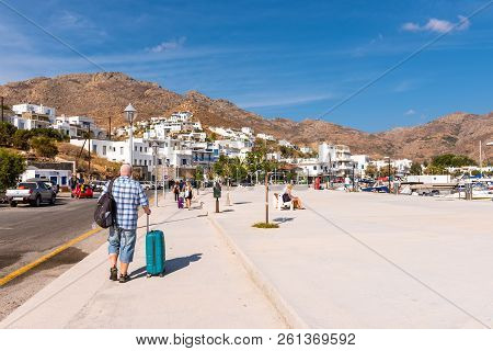Serifos, Greece - September 8, 2018: Tourist Walk On Coastal Promenade In Port Of Livadi. Cyclades, 