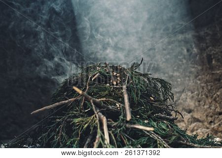 Labrang Monastery, Xiahe, Gansu Province / China - Jun 6 2011: A Pile Of Pine Branch Smoking On The 