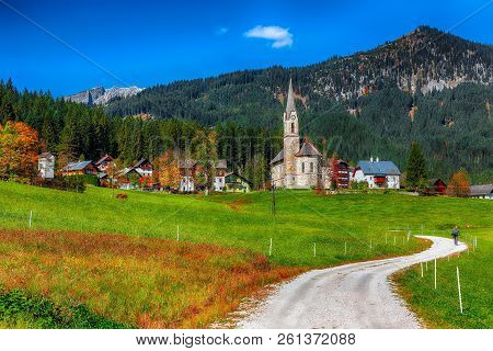 Alpine Green Fields And Traditional Wooden Houses View Of The Gosau Village At Autumn Sunny Day. Loc