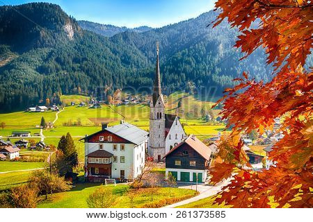 Alpine Green Fields And Traditional Wooden Houses View Of The Gosau Village At Autumn Sunny Day. Loc