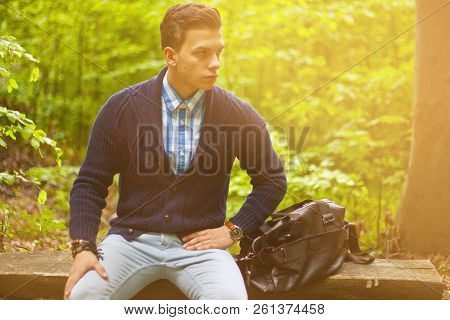 Beautiful Man Sitting On A Bench Tone