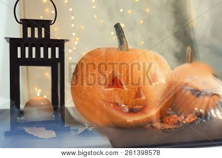 Halloween Pumpkin Heads. Jack Lanterns On Windowsill, View Through Glass