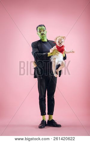 Halloween Family. Happy Father And Children Newborn Girl In Halloween Costume And Makeup. Bloody The