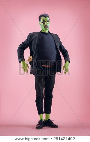 Bloody Halloween Theme: The Crazy Maniak Face On Pink Studio Background
