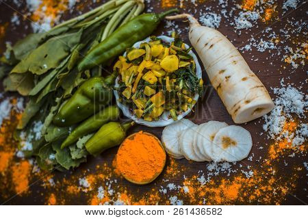 Close Up Of Popular Indian & Asian White Radish Salad Or Muli Ka Smabara On Wooden Surface With Whit