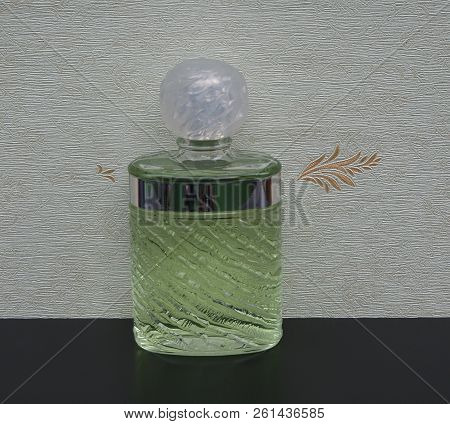 Fragrance For Ladies, Large Perfume Bottle In Front Of The Satin Wallcovering Elysee