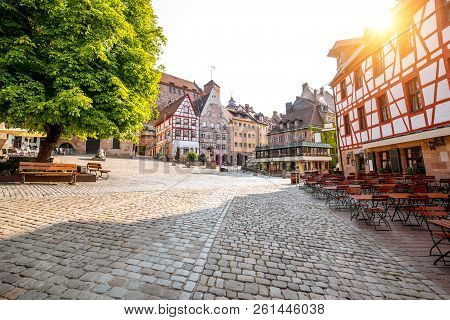 Morning View On The Beautiful City Square With Half-timbered Houses And Old Castle On The Background