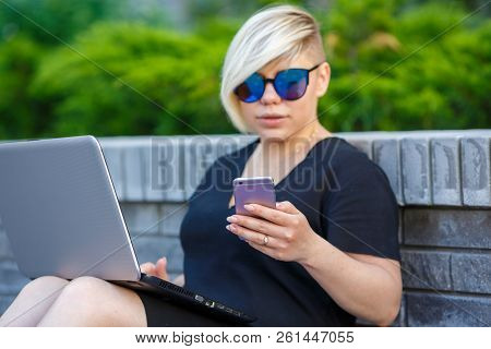 Young Girl Freelancer With Laptop, Student In Sunglasses Plus Size Outdoors, Talking On The Phone, T