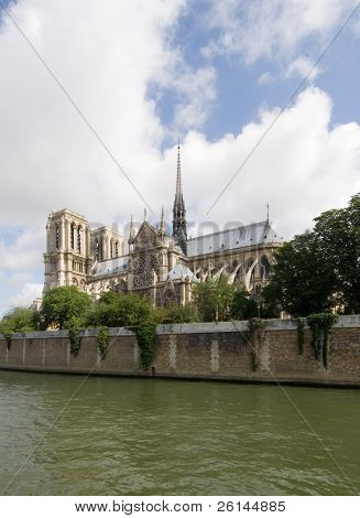 A classic, almost archetypal view of the Notre Dame and Ile de la CitÅ½, seen from across the river Seine in Paris. The cathedral is basking in the sunlight