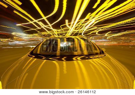 A car driving through the frantic traffic of a busy city during rush hour (Quadruple exposure)