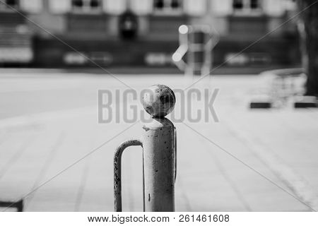Post In Front Of A Bank In Daylight