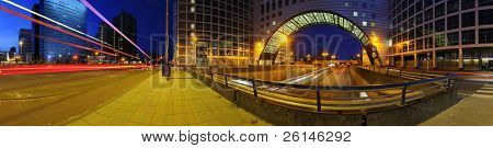 a 360 degrees panoramic image of a roundabout on top of a motorway. A big downtown junction
