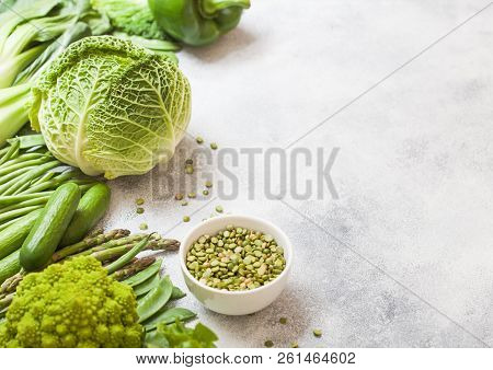 Assorted Green Toned Raw Organic Vegetables On White Background. Avocado, Cabbage, Broccoli, Caulifl