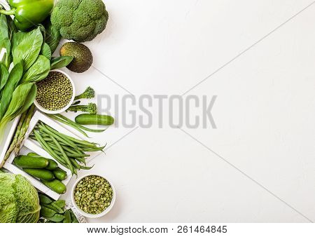 Assorted Green Toned Raw Organic Vegetables On White Background. Avocado, Cabbage, Broccoli, Caulifl