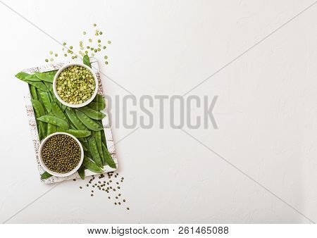 Bowl Of  Mung Beans And Split Peas With Raw Organic Mangetout In Vintage Wooden Box On White Kitchen