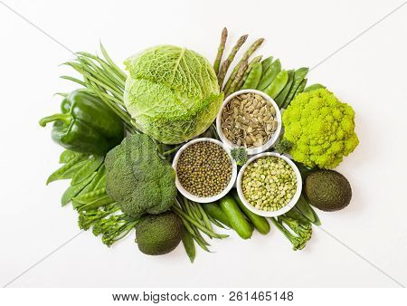Assorted Green Toned Raw Organic Vegetables On White Background. Avocado, Cabbage, Broccoli, Caulifl