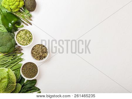 Assorted Green Toned Raw Organic Vegetables On White Background. Avocado, Cabbage, Broccoli, Caulifl