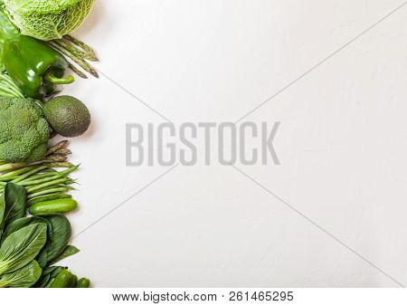 Assorted Green Toned Raw Organic Vegetables On White Background. Avocado, Cabbage, Broccoli, Caulifl