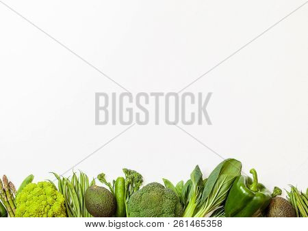 Assorted Green Toned Raw Organic Vegetables On White Background. Avocado, Cabbage, Broccoli, Caulifl
