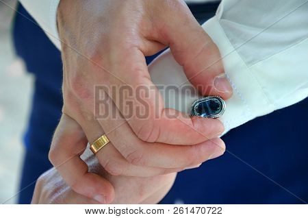 The Groom Straightens Cufflinks On His Shirt. Fees Groom, Wedding And Honeymoon In The Tropics On Th