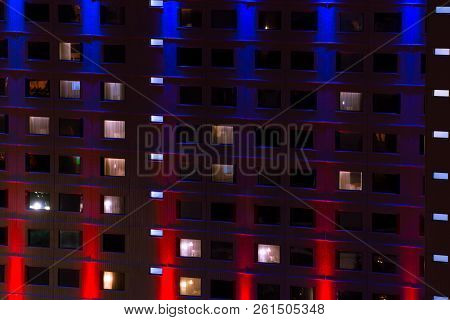 Illuminated Facade Of A House Painted With Lights Illuminating The House